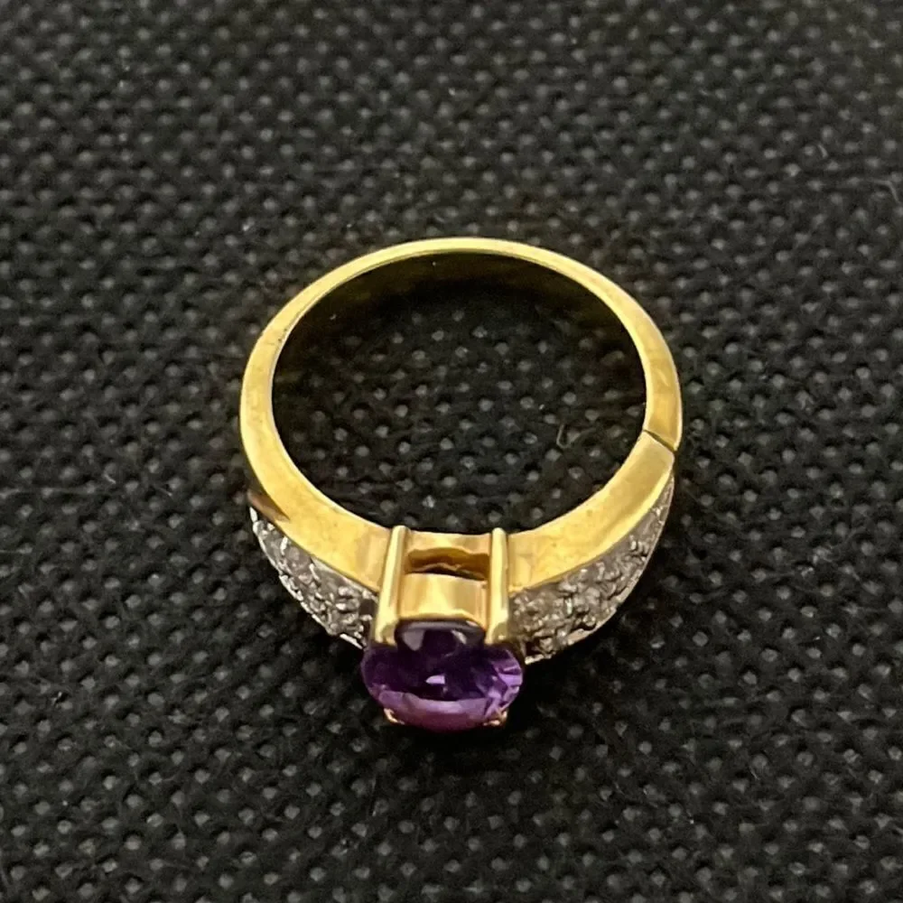 Large ring with a large purple gem